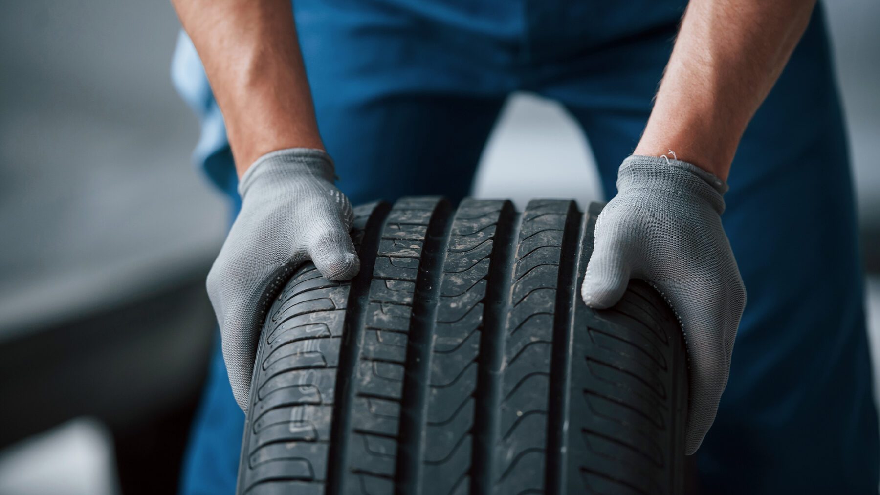 Ensure road safety by checking winter tire tread depth during icy and snowy conditions in cold weather.