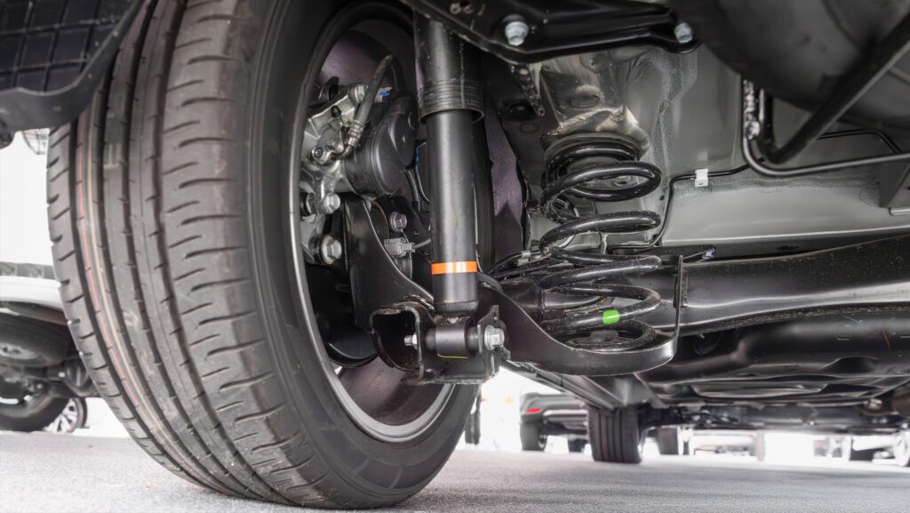 Land Rover air suspension failure showing repair issues, vehicle sagging, and suspension warning light in the dashboard cluster