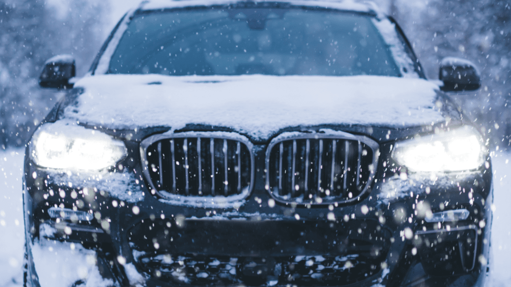 BMW Winter Maintenance Checklist for northbrook showing car being checked for winter readiness near snow.