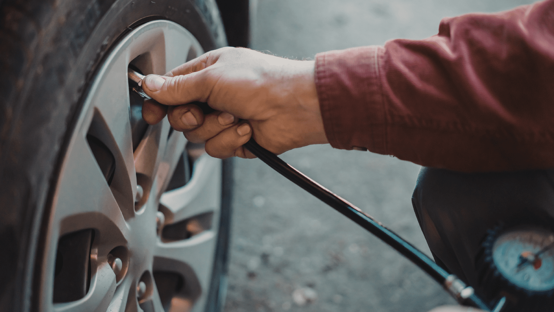 Mechanic completing a wheel alignment to prevent uneven tire wear.