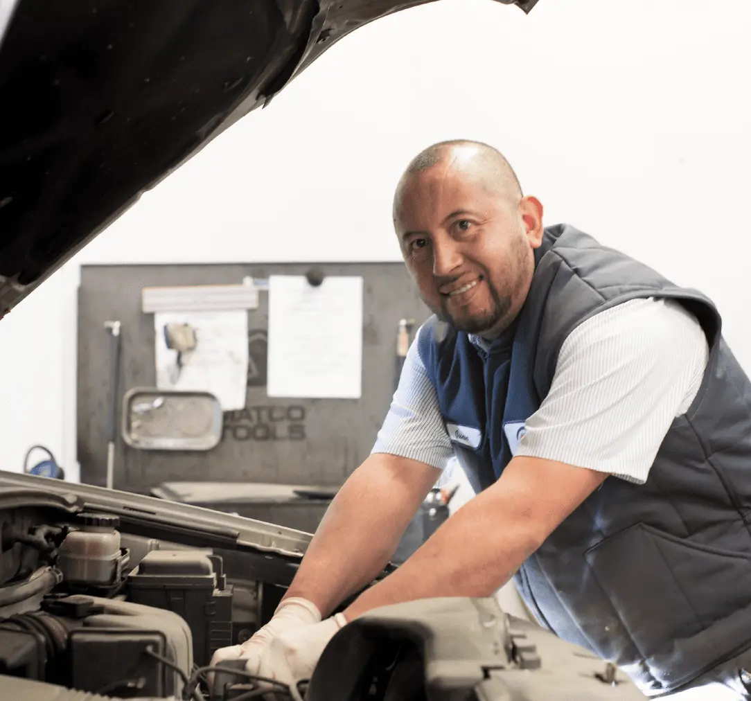 Technician checking car electrical issues