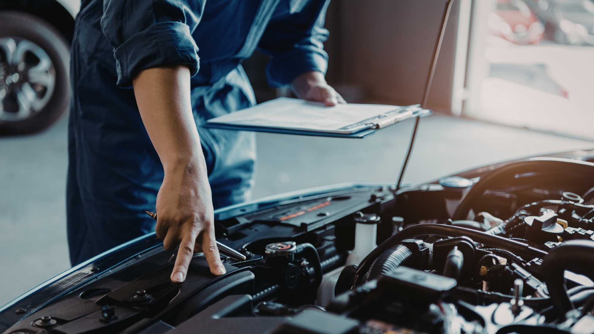 HEART team member explaining vehicle repairs to a customer at HEART Certified Auto Care