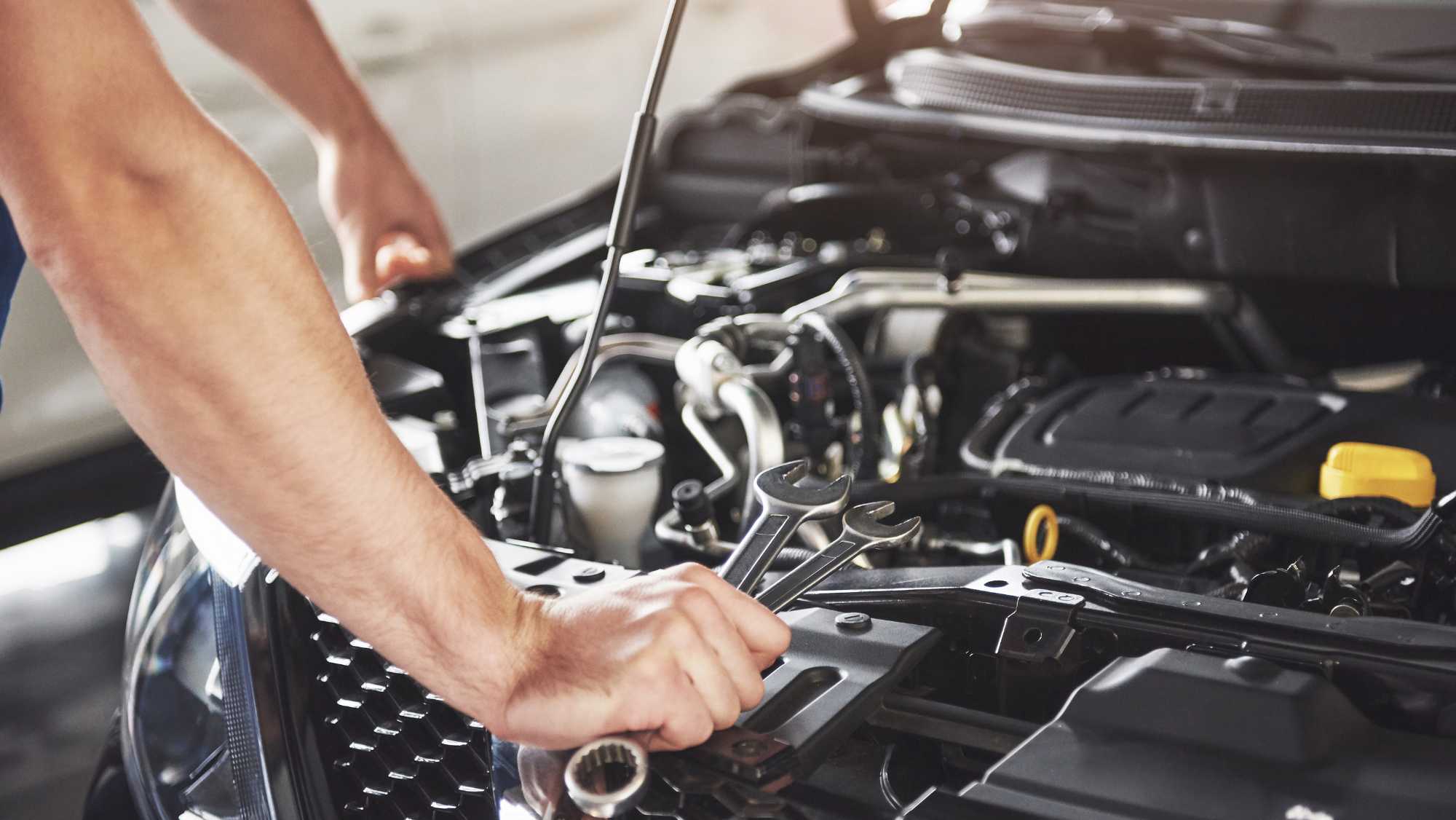 European car repair in Libertyville, technician working on BMW
