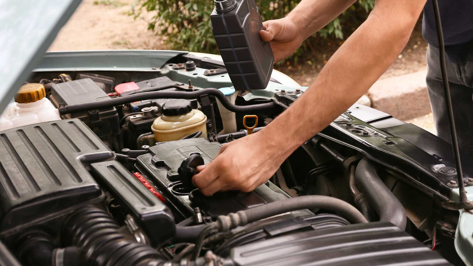 Heart Auto Care technician performing an oil change in Libertyville, IL