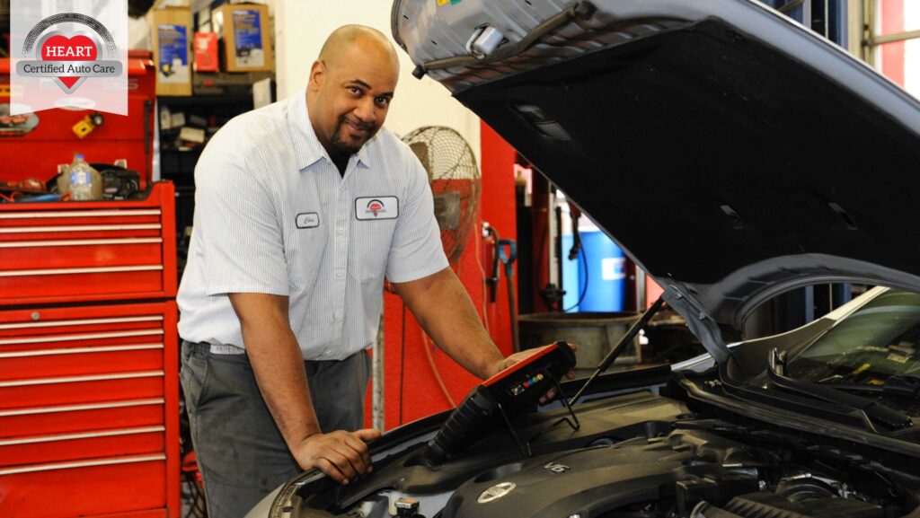 technician performing car battery replacement in Libertyville.