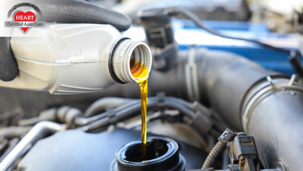 Technician performing oil change service in Bannockburn IL