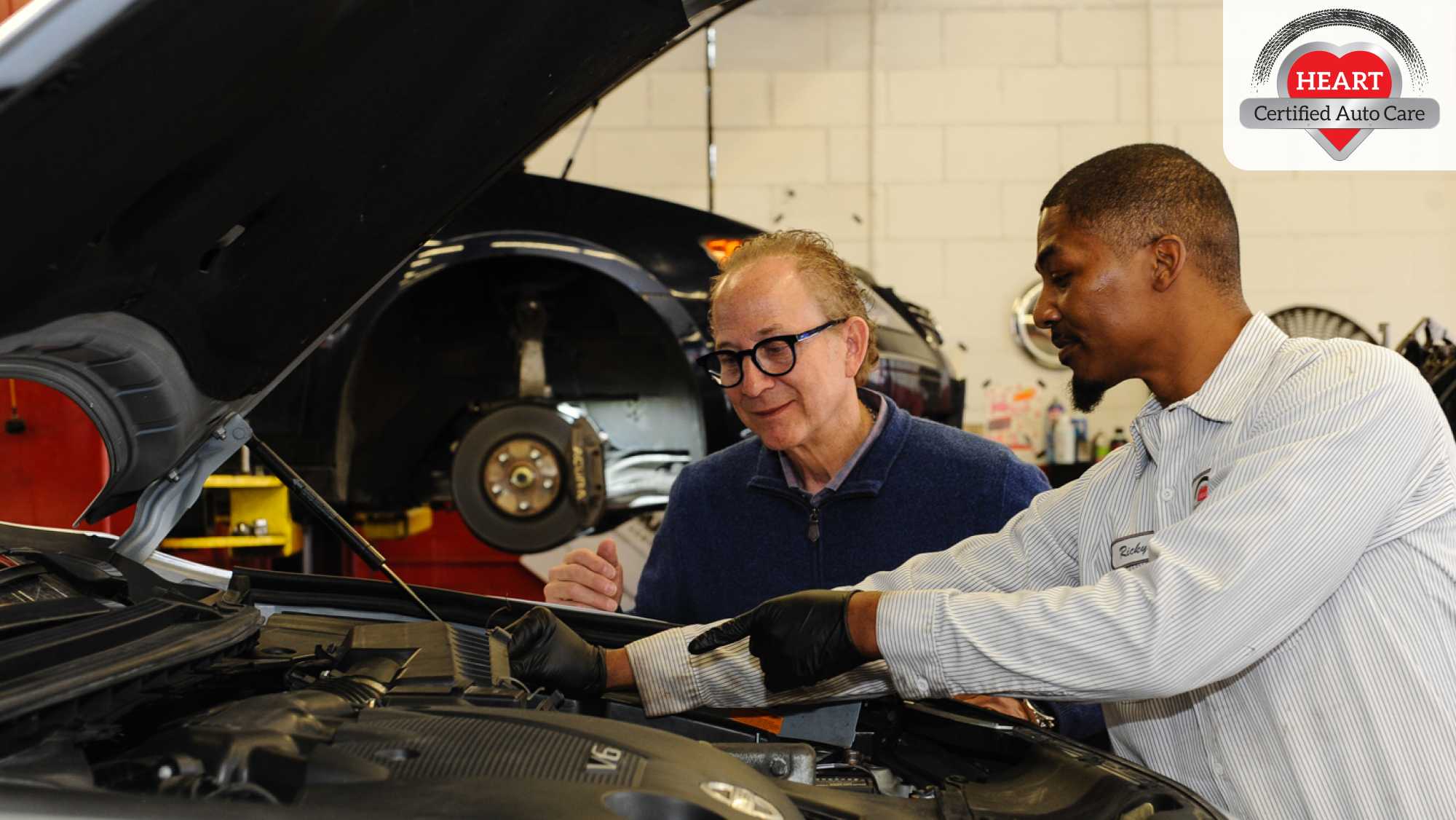 HEART Certified Auto Care Casey Automotive technician performing vehicle inspection