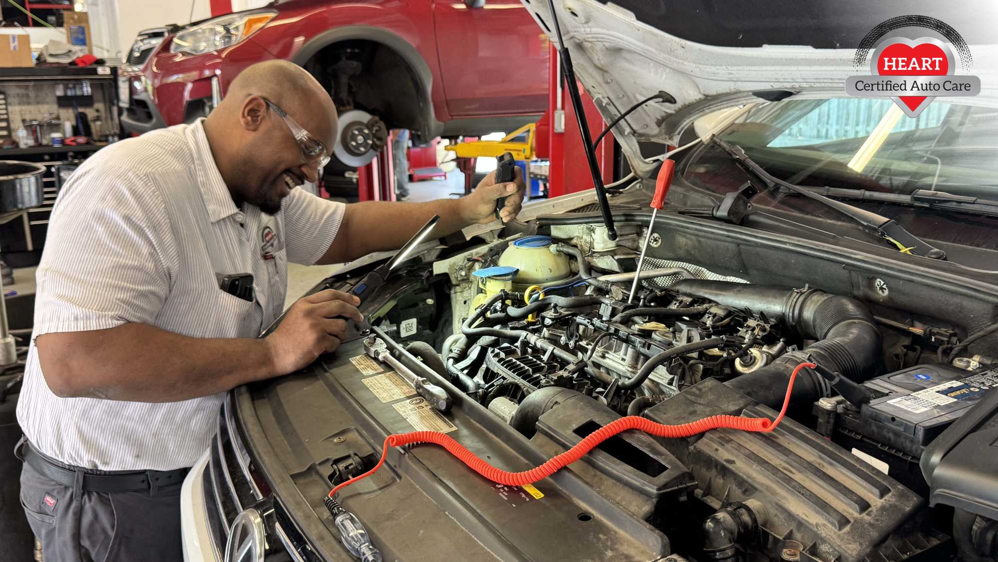 Heart Auto Care Streamwood full-service auto repair shop; ASE-certified mechanics performing vehicle inspection