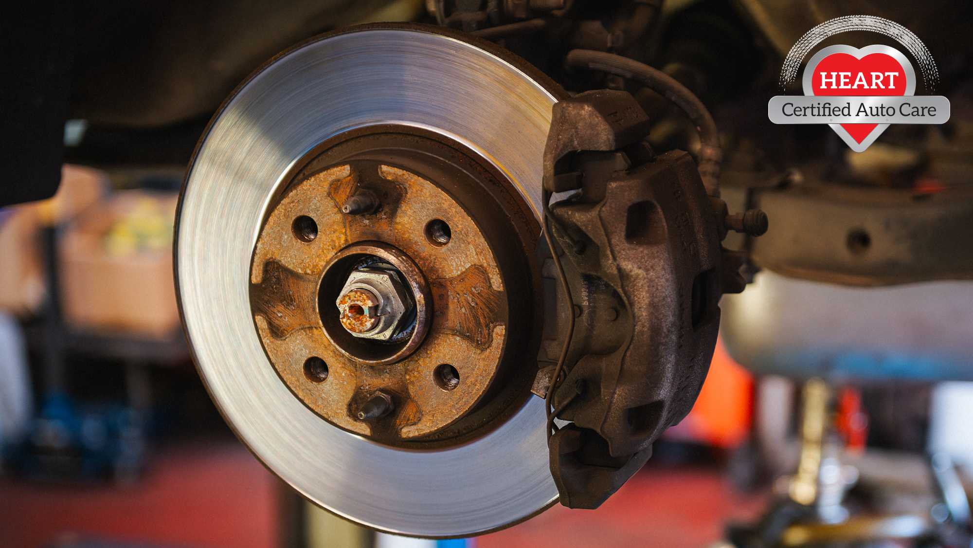 Mechanic inspecting warped brake rotors in Northbrook IL